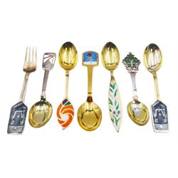 Collection of Danish silver and silver-gilt year spoons by Anton Michelsen, two examples with pierced enamel tree and berry decoration, dated 1932 and 1938, each impressed on underside A.Michelsen Copenhagen, Sterling Denmark, and a further five examples decorated with enamel floral and family designs, dated between 1970 and 1977, each impressed on underside A.Michelsen Sterling Danmark, impressed with varying artist signatures,  approximate gross weight 10.43 ozt (324.3 grams)