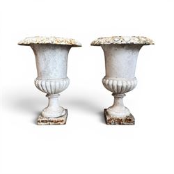 Pair of Victorian revival cast iron garden urns, egg and dart rim, tapering column with ga...