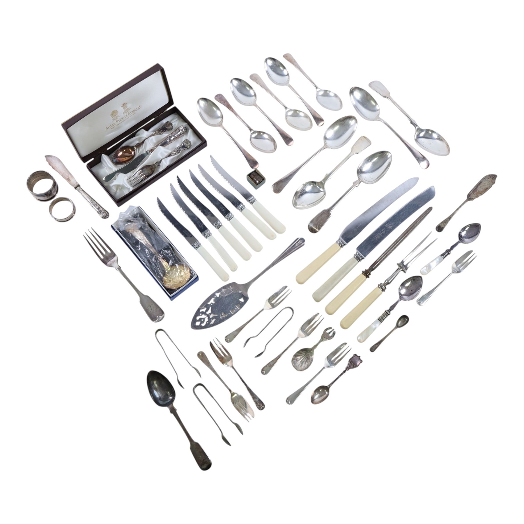 Silver dessert spoon, silver souvenir spoon, silver handled fish knife and two silver napkin rings, together with a collection of silver plated cutlery