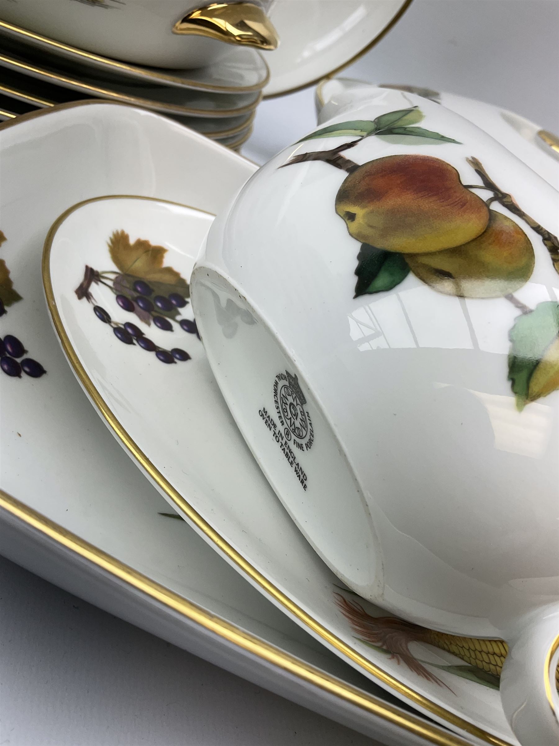 Royal Worcester Evesham dinner service including dinner plates, bowls and side plates all sets of six, five soup bowls, gravy boat and dish, four serving dishes with lids,  one platter, two serving dishes, two jars with lids and two other dishes. 