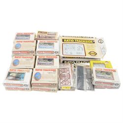 Twenty-two Ratio Trackside Series unbuilt 00 gauge model railway building kits, including two 522 Engine Sheds, thirteen 515 Platform Canopies, five 502 Cattle Docks, 540 Locomotive Servicing Depot and 529 Oil Depot, together with a collection of Ratio Trackside unbuilt accessory kits, including gutters, pipes, window arches, etc all boxed or carded