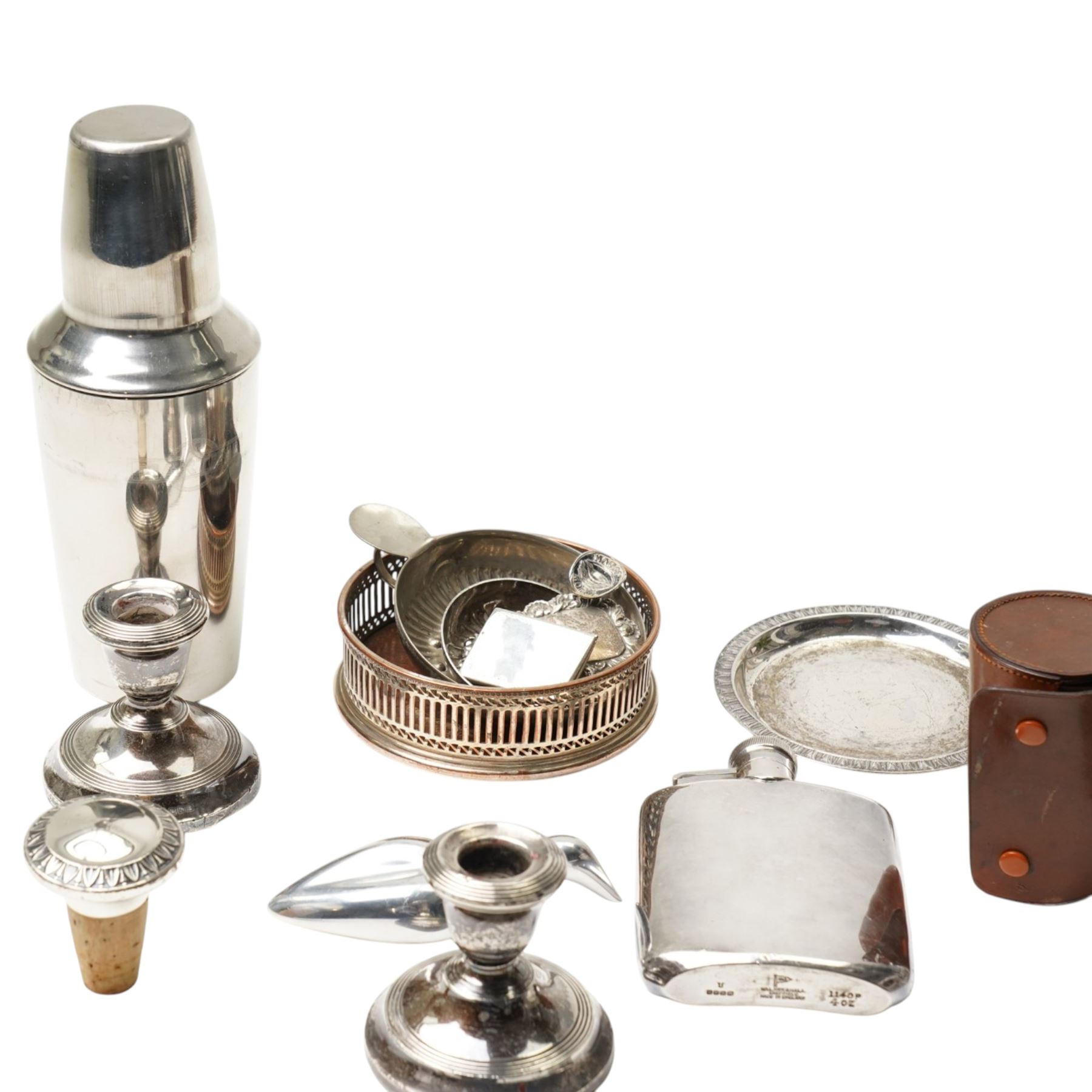 Pair of silver dressing table candlesticks, miniature folding photograph frame, silver port label, plated cocktail shaker and other silver plated items