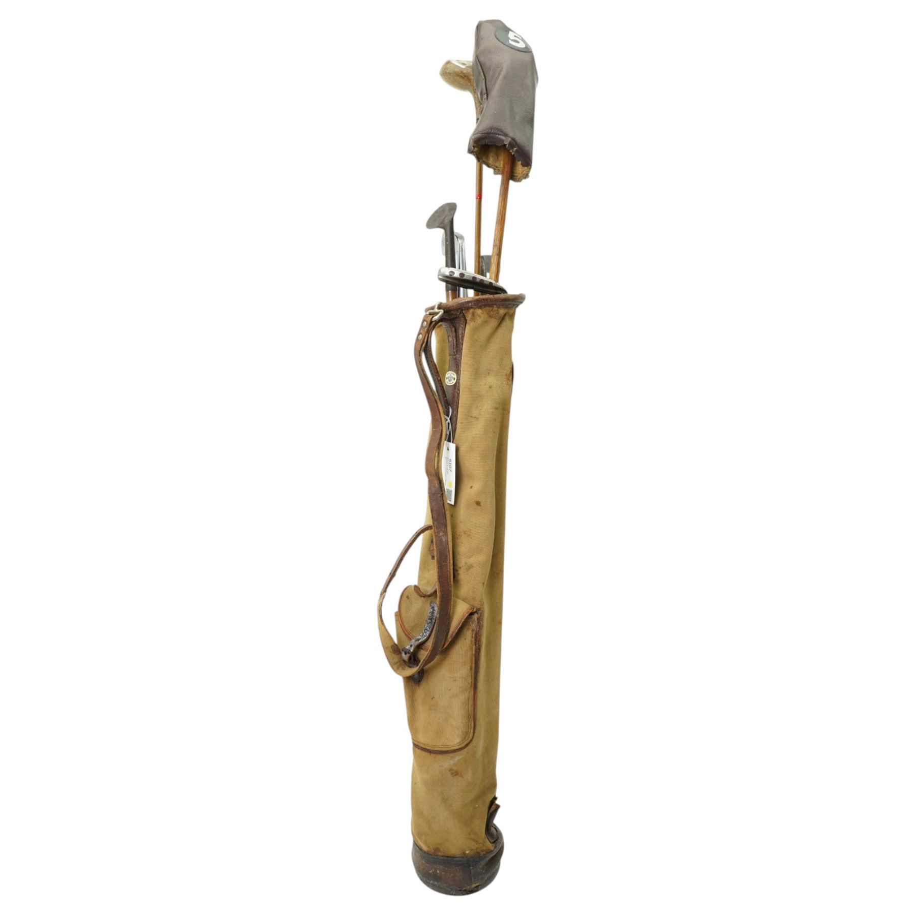 6 Hickory shafted golf clubs including Niblick by Forgan & Son, St Andrews, three putters and two woods in a canvas bag 