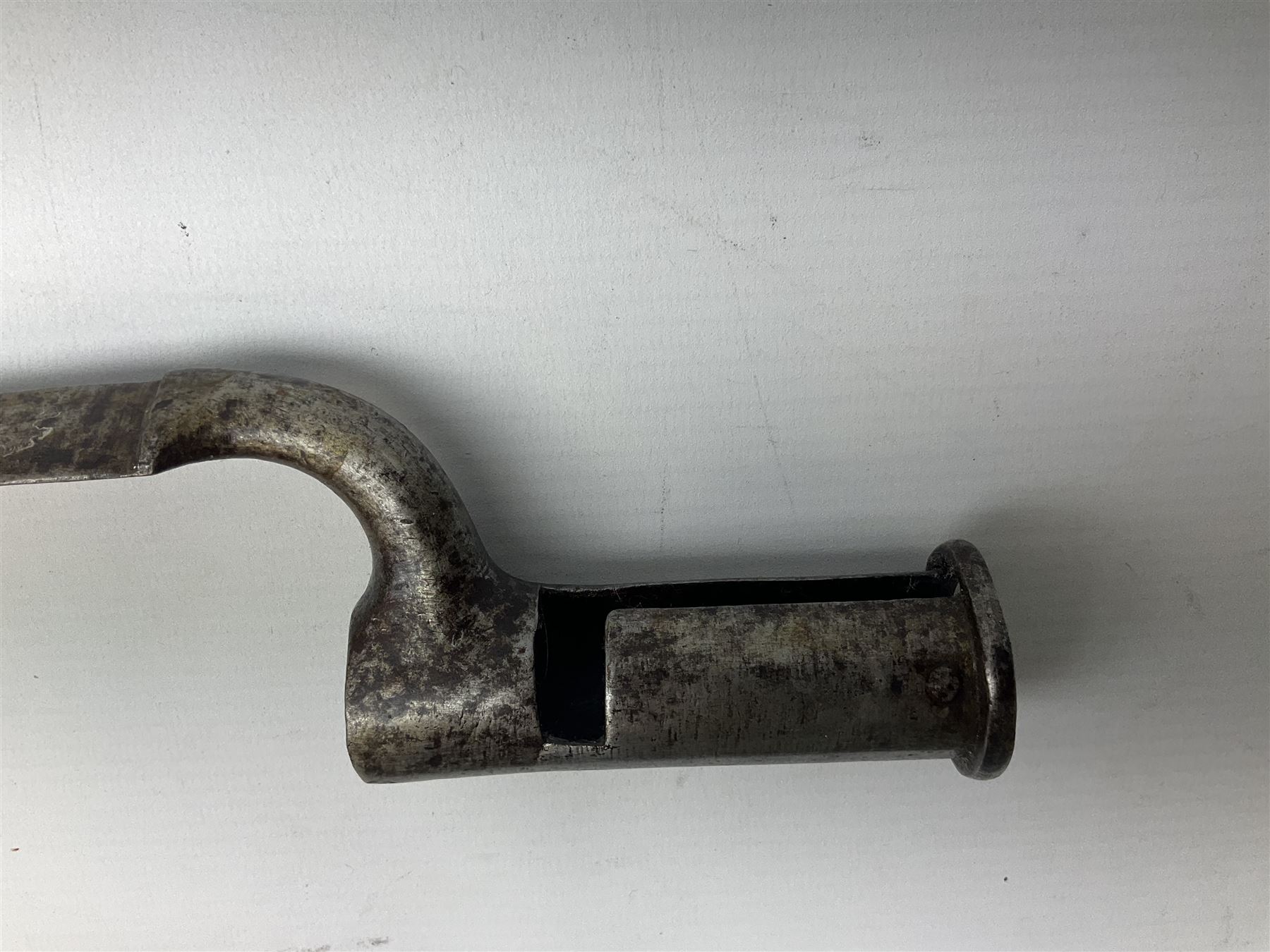 British pattern 1876 socket bayonet with 55cm triangular blade; another smaller socket bayonet; and a leather shot flask, the brass action marked Sykes (3)
