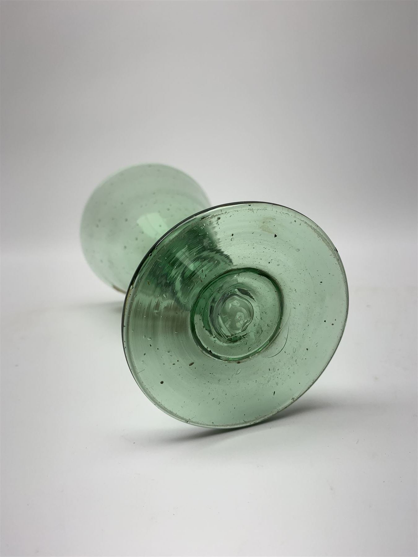 19th century bohemian green glass wine glass, the funnel bowl decorated in enamells with a Historismus hunting scene in the manner of Egermann & Lobmeyr, upon a baluster stem and circular foot, H14.5cm