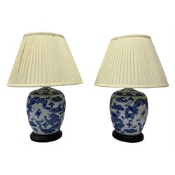 Pair of Chinese ginger jar style lamps, decorated with blue dragons, H52cm (including shades)