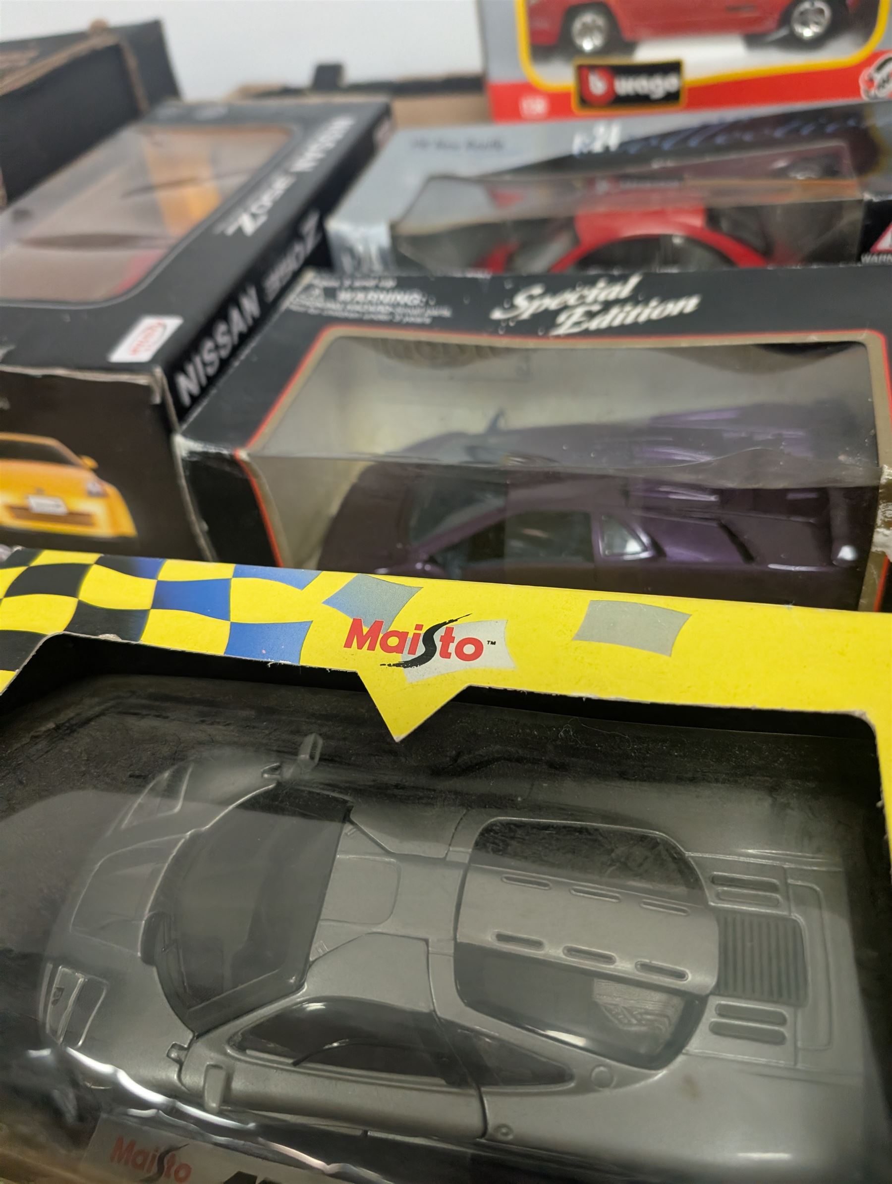 Fourteen 1:18 and 1:24 scale diecast model vehicles, including Classico Ferrari 1972 312, DX RC Lamborghini Gallardo, Maisto Silver Edition Porsche Boxter, , Bburago Williams Fw14, Bburago Ferrari 641/2, etc all boxed