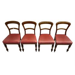 Set four Victorian mahogany balloon-back dining chairs, seats upholstered in crimson faux leather with studwork, on turned supports