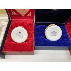 Eight Christmas themed Halcyon Days enamel boxes, and a Halcyon Days enamel bonbonniere modelled as a snowman, each in fitted box 
