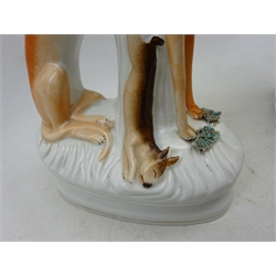  Pair of Victorian Staffordshire seated Greyhounds with dead game, H32cm   