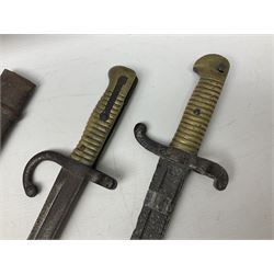 French Model 1874 Epee bayonet marked Oulle 1876 in associated scabbard; Model 1866 sabre bayonet in cut-down sword scabbard; and Model 1842/59 sabre bayonet in relic condition (3)