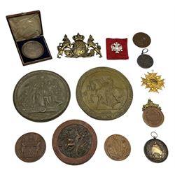 Collection of bronze and brass medallions, depicting busts and classical scenes 