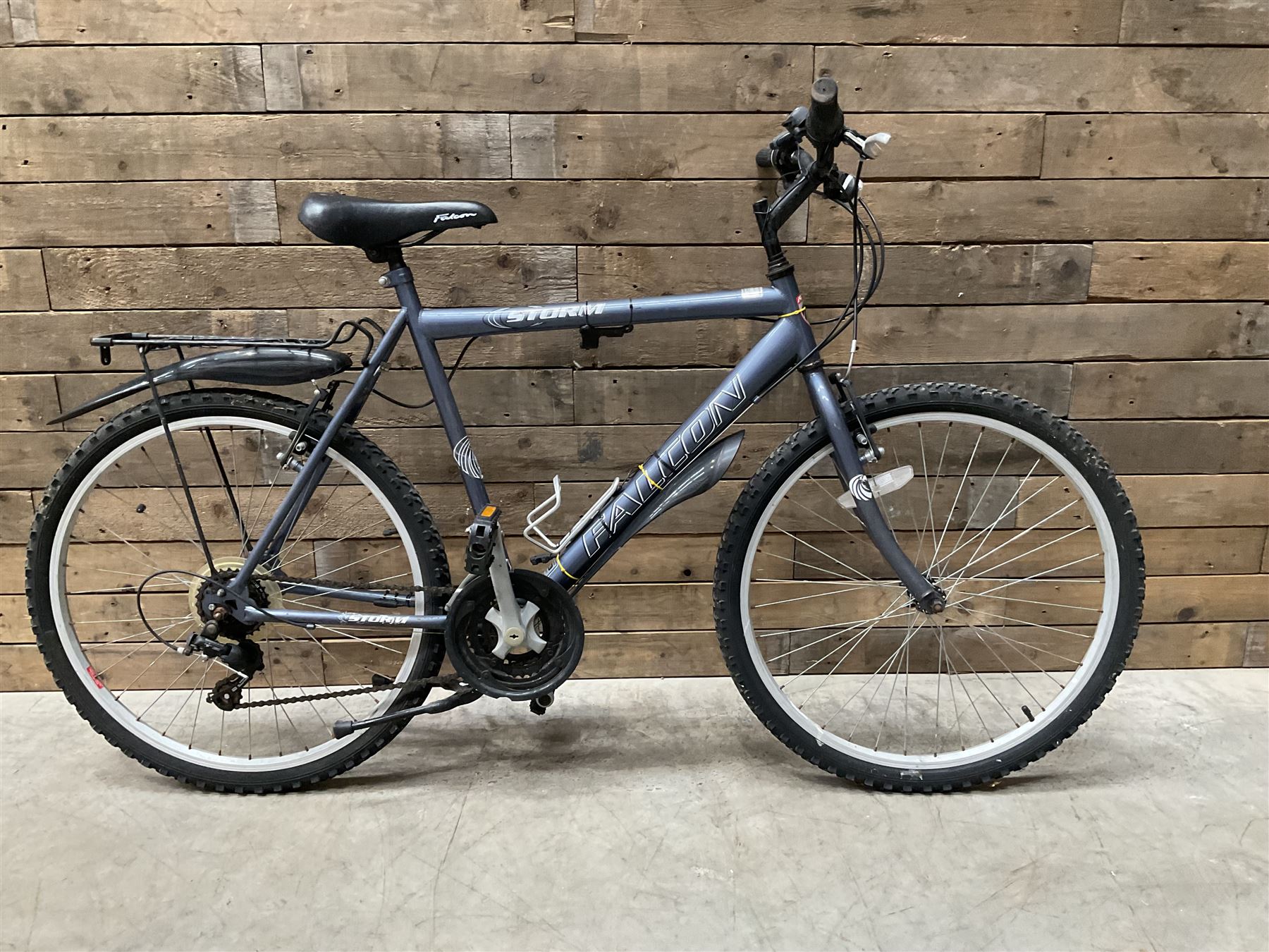 Three bicycles- man’s Falcon Storm 18 speed mountain bike; lady’s Dawes Sonoran 24 speed road bike; child’s Apollo 18 speed bike (3)