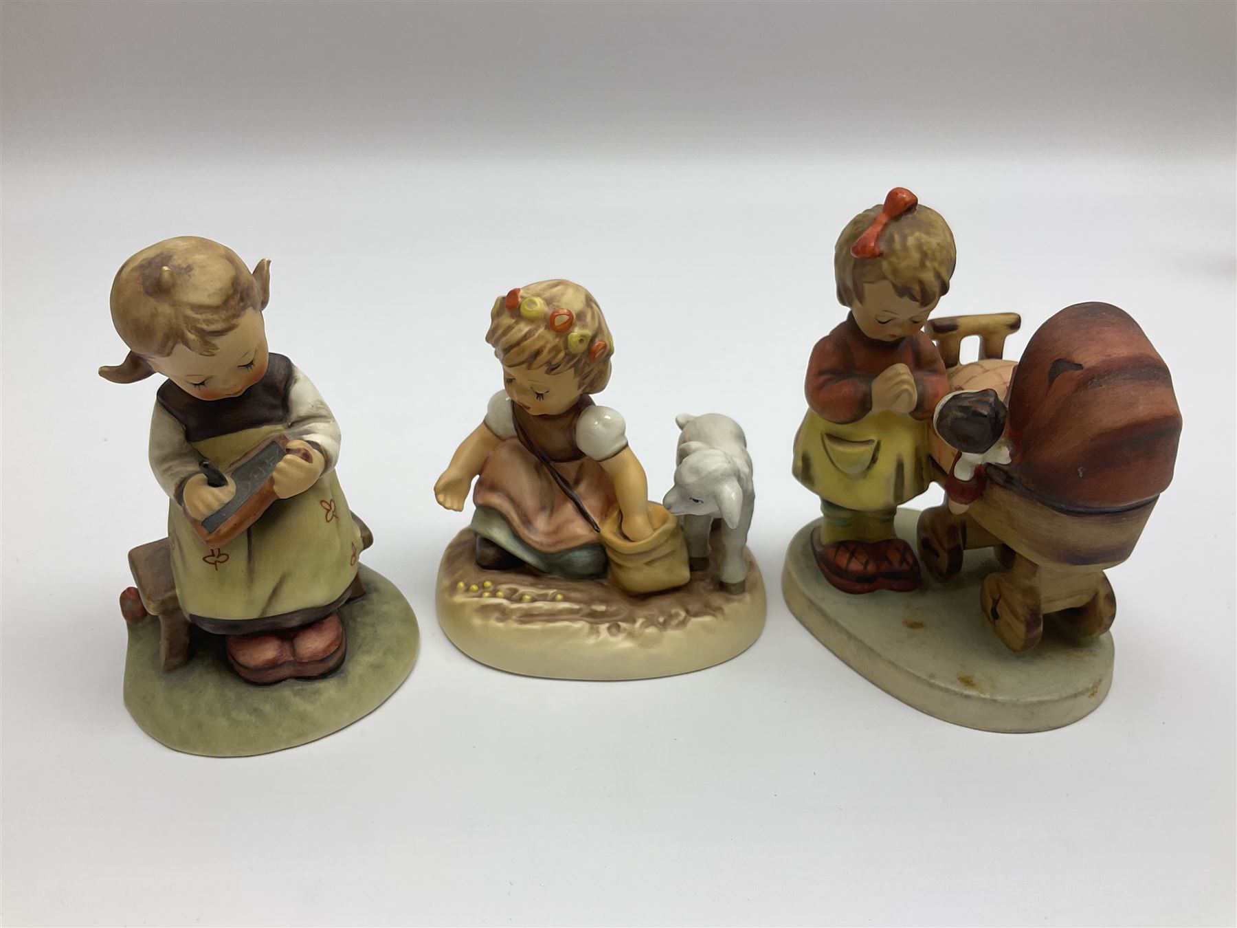Twenty six Hummel figures by Goebel, to include Fire Fighter, Band Leader and Spring Sowing
