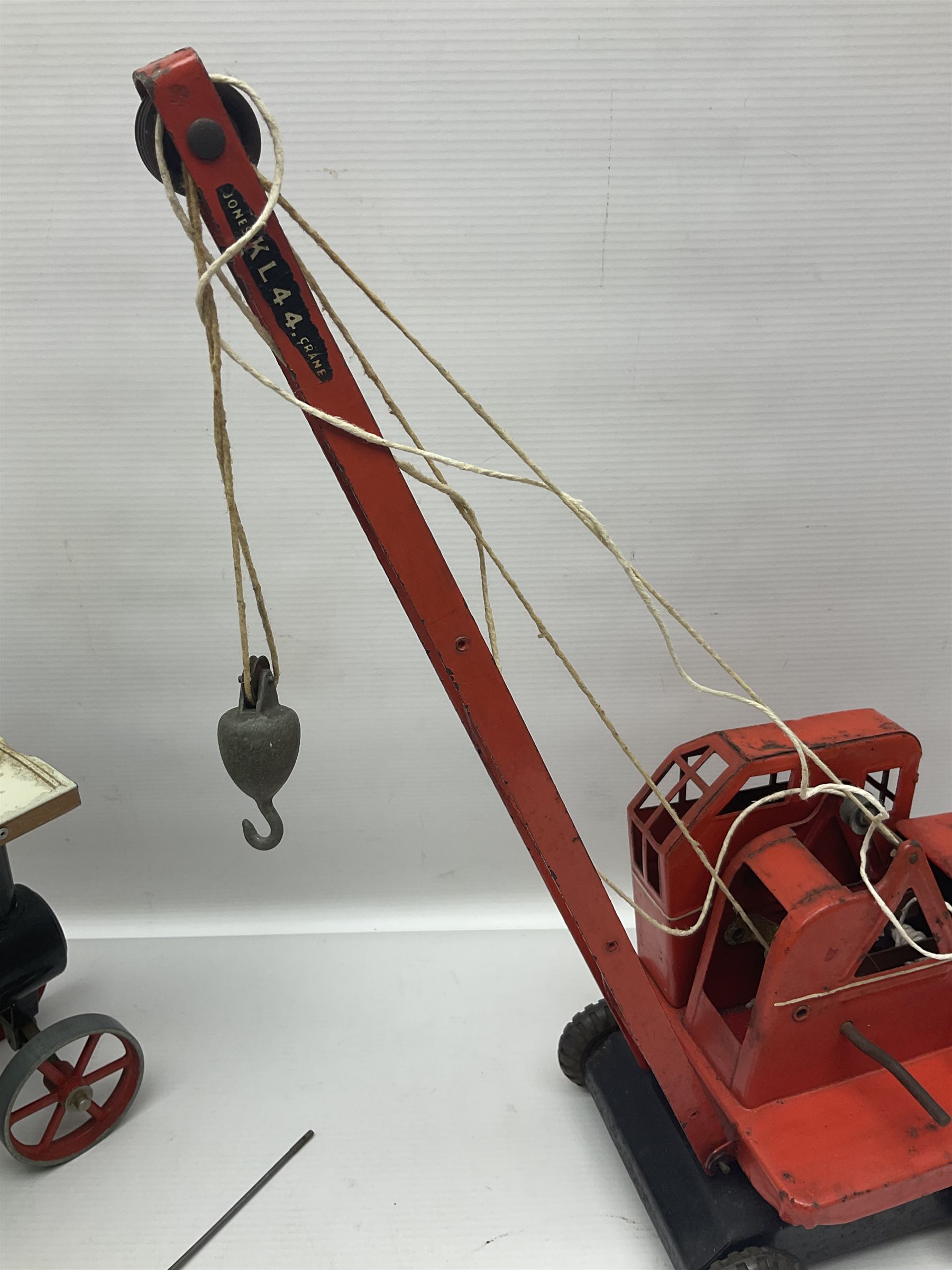 Mamod TE1a steam traction engine with burner, bunker, steering rod and funnel; red and black painted Tri-ang tin-plate Jones KL44 mobile crane; and two Hull Savings Bank Home Safe money boxes; all unboxed (4)