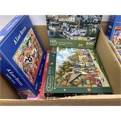Large collection of jigsaw puzzles and games, to include examples from Gibsons, in four boxes 