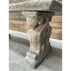 Cast stone garden Rams Head bench, two pillars set with architectural rams heads, rectangular slab seat