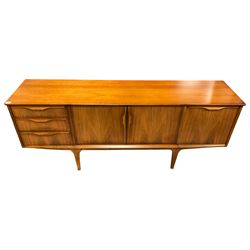 Jentique - mid-20th century teak sideboard, fitted with three drawers, double cupboard and fall front cupboard, raised on tapering supports