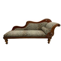 Victorian mahogany framed chaise longue, shaped arm carved with acanthus leaves, the scrolled back with applied carved rosettes,upholstered in monochrome leopard print fabric with bolster cushion, raised on turned supports