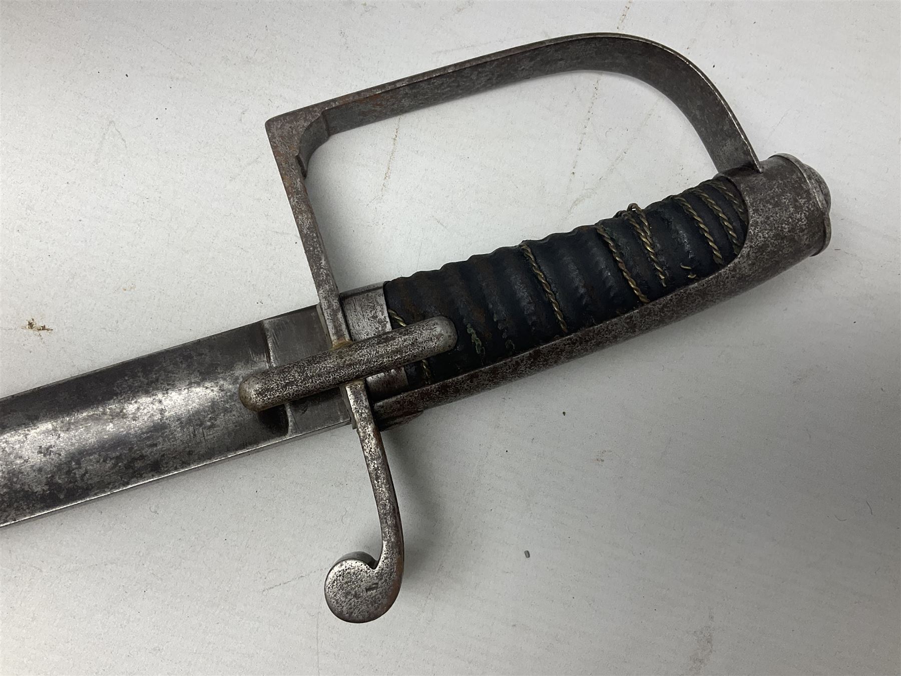 Italian M1833 Sabre with slightly curving 79cm fullered steel blade, the plain steel hilt with 'D' shaped knuckle bow, langets and wire-bound leather grip; in steel scabbard with single hanging ring L101cm overall