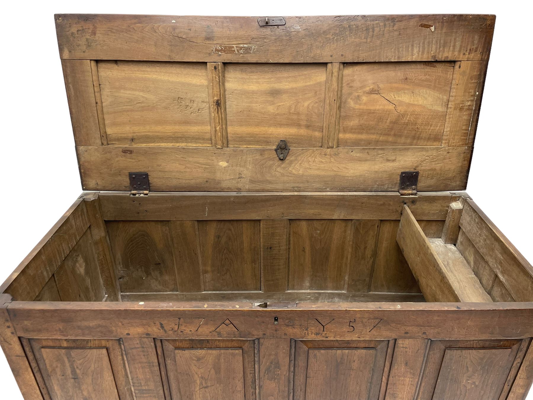Georgian oak mule chest, moulded rectangular hinged lid over quadruple fielded panel front, the frieze inscribed '17 A Y 57', fitted with two drawers, panelled ends and back, on stile supports