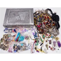 Assorted costume jewellery and jewellery making materials including necklaces, pendants, bracelets, beads and loose gemstones, with a decorative jewellery box