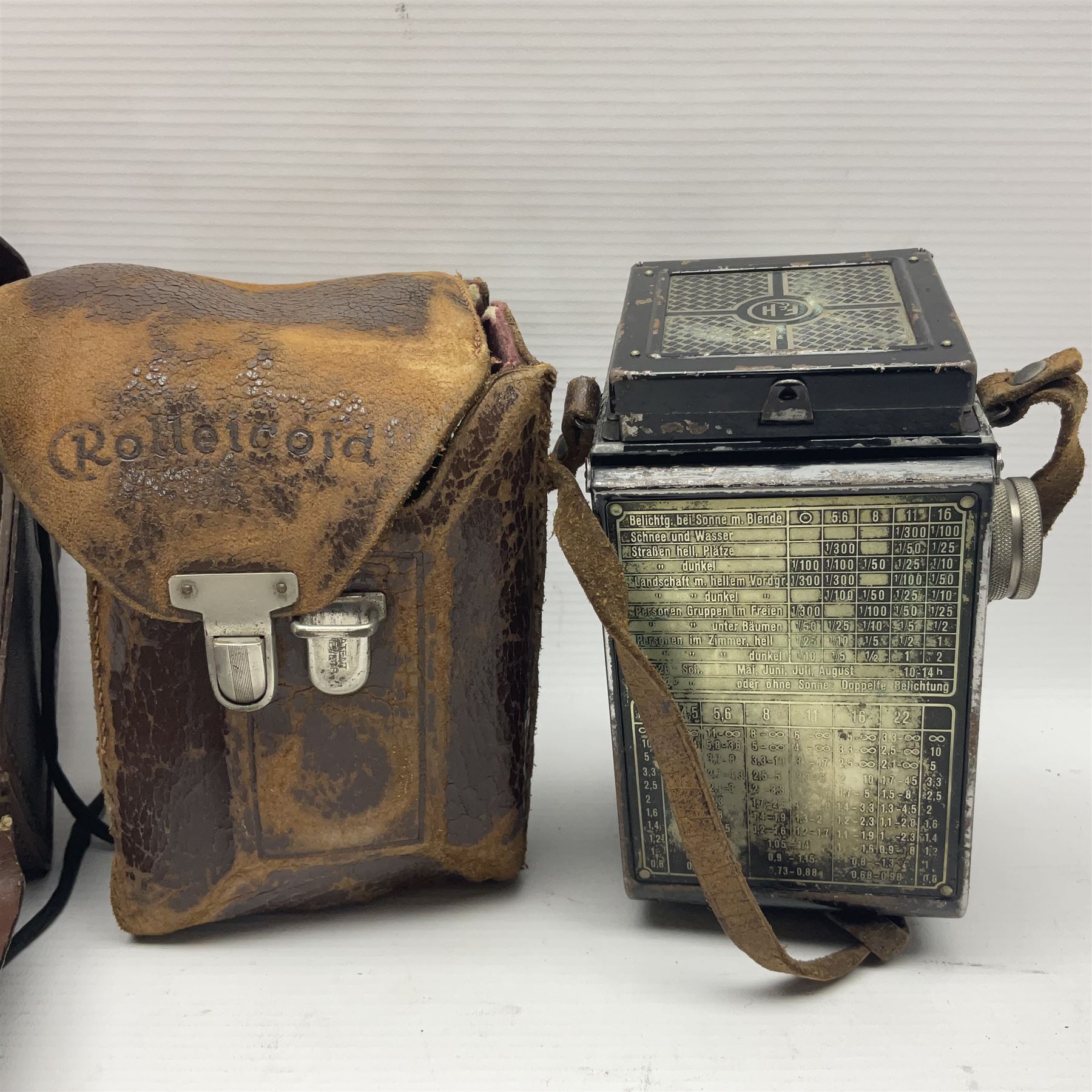 Franke & Heidecke Rolleicord twin lens camera, serial number 012706 with Heidoscop-Anastigmat f=7.5cm' lens and a 'Carl Zeiss Jena Triotar 1:4.5 f=7.5cm' lens, serial no 1474898, together with three similar cameras, including SEM TLR, serial no 420218, Ising Pucky box and Ferrania Elioflex, three in leather carry cases