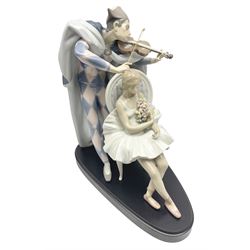 Large Lladro figure, Jester Serenade, modelled as a ballerina with bouquet of flowers seated before a jester playing the violin, limited edition 1894/3000, sculpted by  Antonio Ramos, with original box, no 5932, year issued 1993, year retired 1994, H37cm