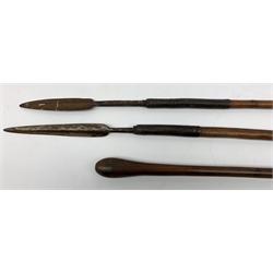  Two tribal hunting spears, one example with bamboo cane, each approx L111cm, together with a club.   