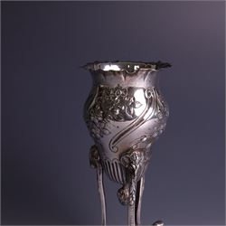 Late Victorian silver vase, of baluster form with fluted rim, the body with embossed floral decoration, upon three tall legs with ramshead mounts, hallmarked William Comyns & Sons, London 1890, H13.5cm