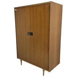 Wrighton - mid-20th century teak wardrobe, two doors enclosing hanging rail, shelves and hinged compartments, on turned tapering feet
