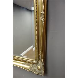  Gilt framed wall mirror with bevelled glass, 106cm x 76cm  