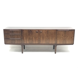 AH McIntosh - 1970s rosewood sideboard fitted with three drawers, double cupboard and fall front compartment, W205cm, H75cm, D44cm - CITES License applied for