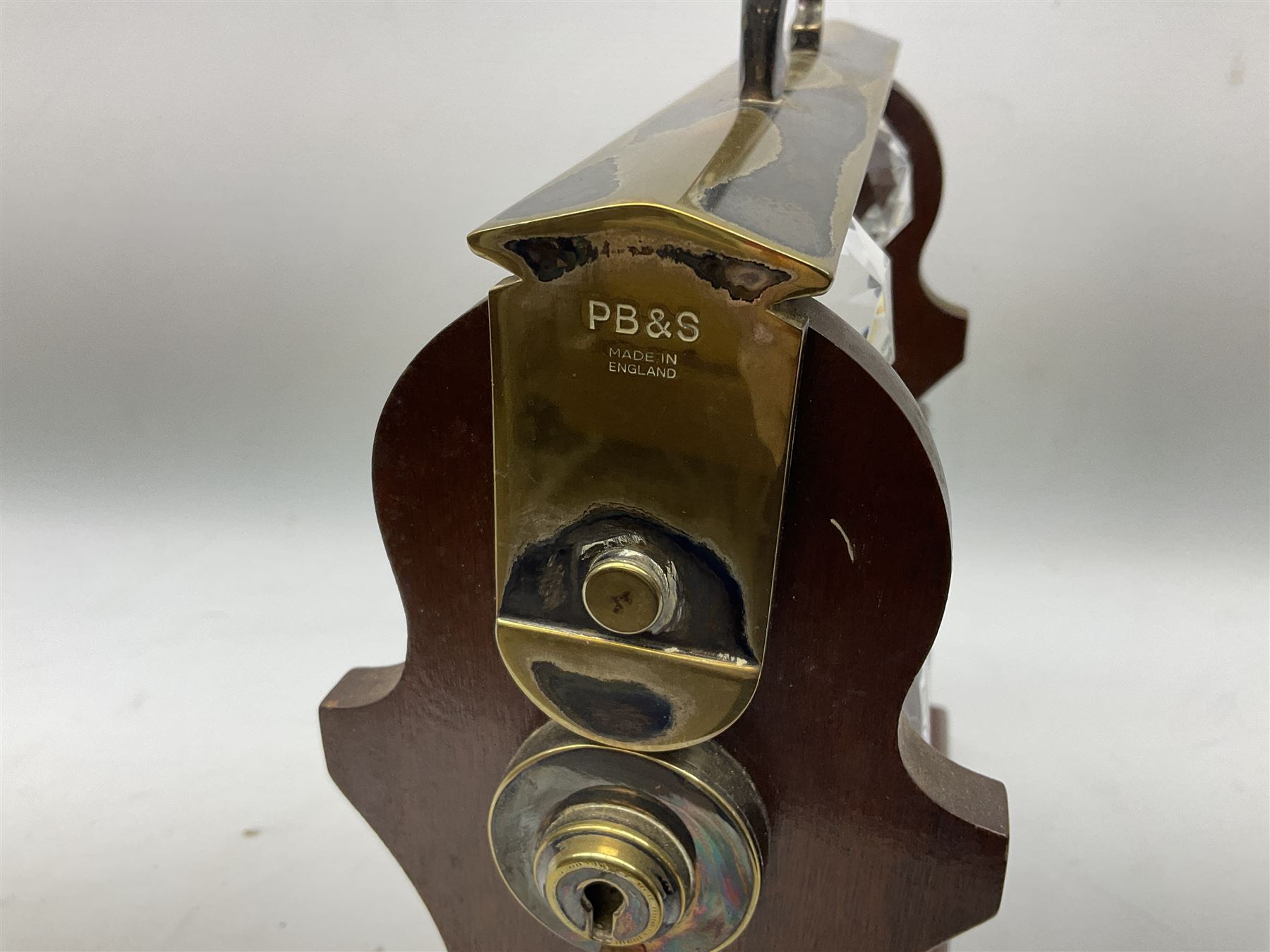 Late 20th century mahogany and silver plated two cut glass decanter tantalus, marked PB&S, with Whisky and Gin Crown Staffordshire ceramic decanter labels, H32cm