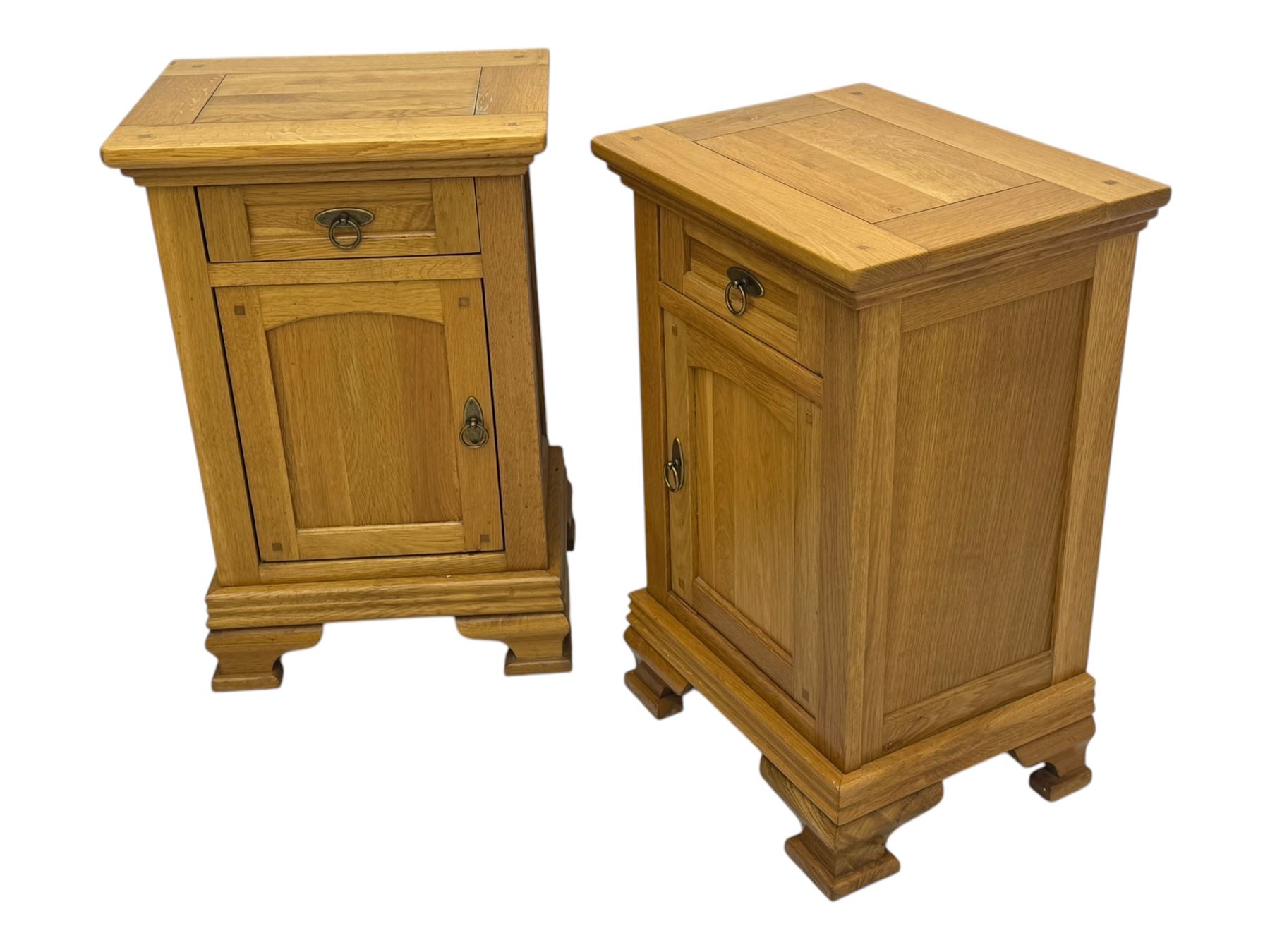 Frank Hudson - contemporary pair of light oak bedside cabinets, each with moulded rectangular top over single drawer above cupboard door with arched panel, on a moulded plinth base with bracket feet