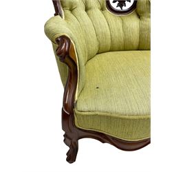 Victorian walnut settee, triple back with pierced and scroll-carved cresting rails over carved fruit and foliage decoration, upholstered in buttoned green fabric, serpentine seat and carved apron, on cabriole feet