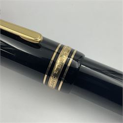 Montblanc Meisterstuck No. 149 fountain pen, the black plastic barrel and cap with gilt clip and banding, and 14ct white and yellow gold nib marked 4810 14C 585, L14.5cm