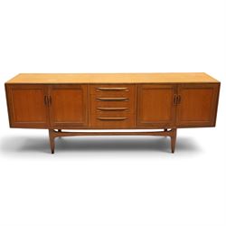 G-Plan - 'Fresco Long John' teak mid 20th century sideboard, a central bank of four drawer...