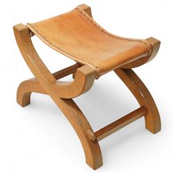 Rabbitman - curved x-framed stool with slung leather seats, adzed throughout the frame with signature Rabbit carving by Peter Heap of Wetwang