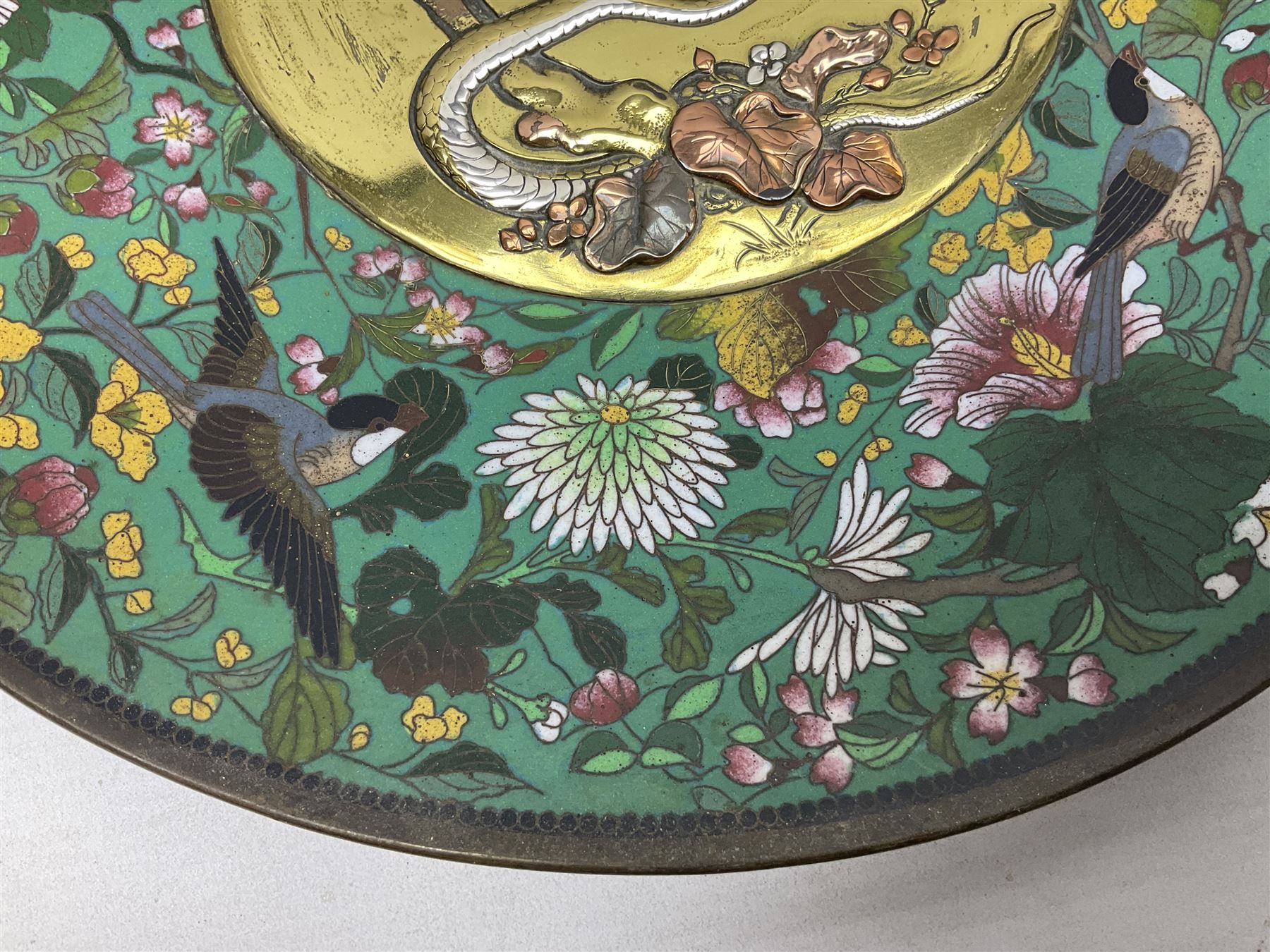 Cloisonné plate decorated with birds and flowers, together with a pair of Cloisonné vases of baluster form 