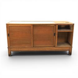 Early 20th century oak framed and glazed haberdashery shop counter with sliding doors and cupboards