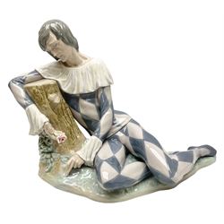 Lladro figure, Harlequin Reclining, modelled as a recumbent harlequin, no 5128, Sculpted by Salvador Furio, year issued 1982, year retired 1987, H28cm 
