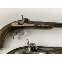 Pair of Muller & Lyon 11mm (approx. .42 cal.) percussion target pistols each with 24.5cm rifled octagonal and fluted barrel, plain action and hammer, unchequered walnut stock with inverted crown shaped butt plate and hooked trigger guard, no set trigger or half cock safety, numbered 1 & 2 on top of breech, L42cm overall; in baize lined fitted walnut case with all accessories including miniature copper powder flask, scissor action bullet mould, nipple key with screw-driver attachment, turned hardwood mallet and graduated pair of lidded boxes, brass rammer, cleaning rod etc, case L55.5cm