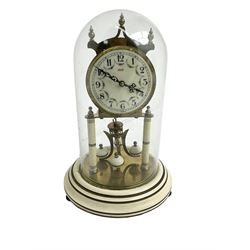 Mid-20th century Kundo torsion clock - Keininger & Obergfell German 400-day clock with a glass dome , enamel dial and pierced steel hands, arabic numerals and floral swags, movement supported by two pillars on a painted circular base, torsion suspension intact, with key.
