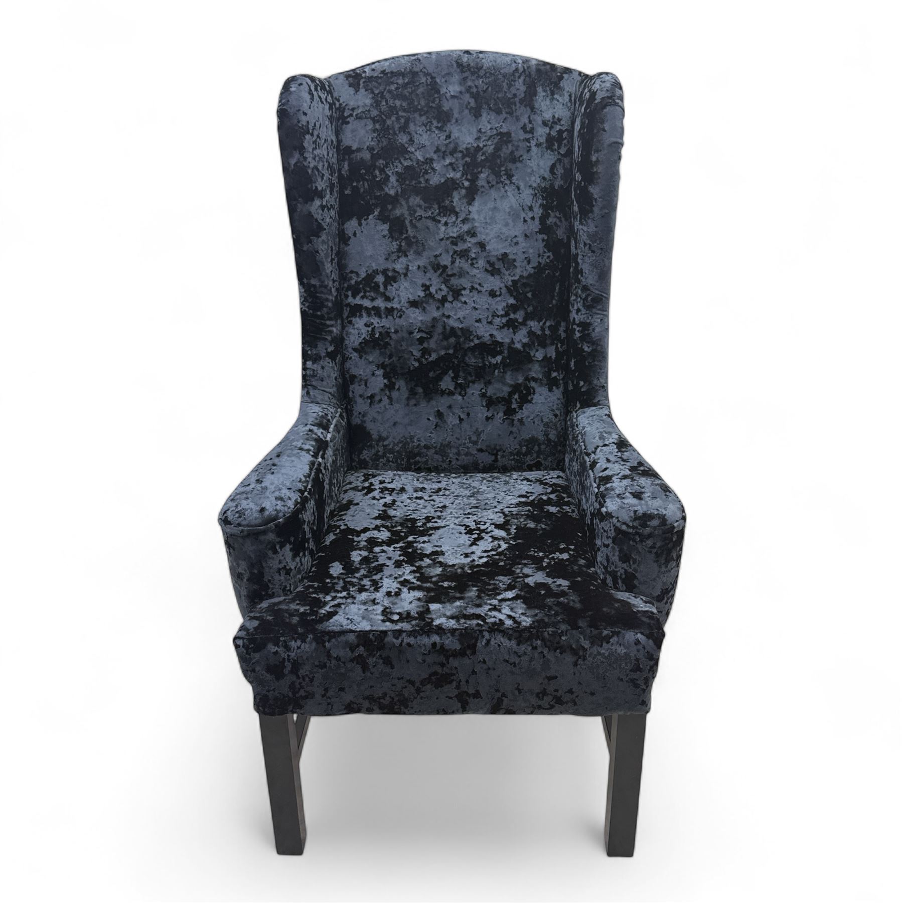 Oka - Pair of contemporary upholstered wingback armchairs, in black and blue textured velvet effect fabric, with tall scroll wing sides and square tapered legs joined by stretchers