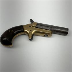 Colt .41 calibre rim-fire third model deringer with 6.5cm barrel marked COLT, brass frame stamped .41cal with C and rampant colt mark, sheath trigger and two-piece varnished wooden grips L13.5cm overall; with one inert cartridge