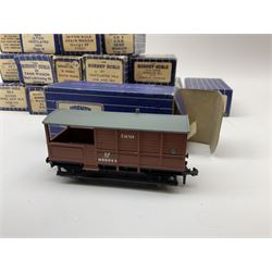 Hornby Dublo - twenty wagons including Cattle Truck; Low-Sided Wagons; Cable Drum Wagon; Tank Wagon for Shell Lubricating Oil; Mineral Wagons; 20-Ton Bulk Grain Wagons; Goods Brake Vans; Sand Wagons; Ventilated Van; Double Bolster Wagon etc; all in blue striped boxes (20)
