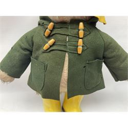 Vintage Paddington Bear teddy with yellow felt hat, green coat and yellow Dunlop boots, H48cm