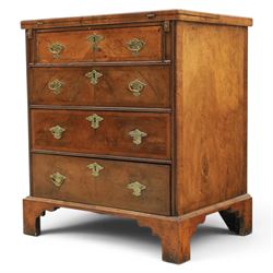 Early 20th century Georgian design figured walnut bachelor's chest, with half fold over top and lopers, over three drawers with pierced brass handles and escutcheons 