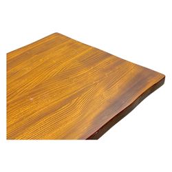 Late 20th century oak trestle table, rectangular top with naturalistic edge, supported by two curved pedestal bases united by central stretcher, on block feet